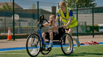 girl on bike at sports ability day